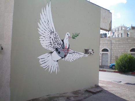 Banksy, Peace Dove, 2007. Photo Ed from Saaaarf London, UK, CC BY 2.0, via Wikimedia Commons